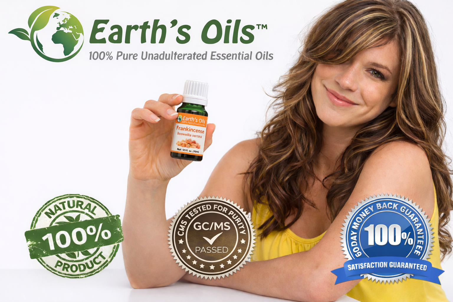 Woman holding Earth's Oils essential oil bottles with brand logos on a white background